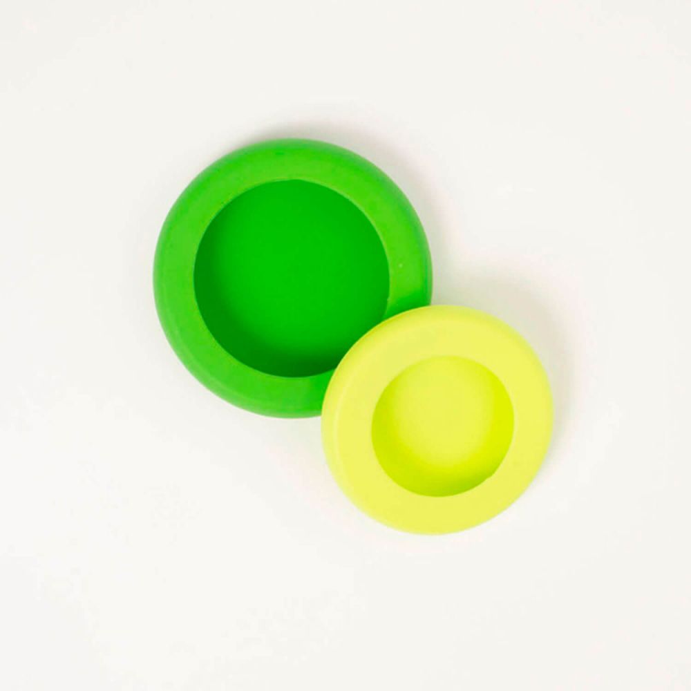 Tapa ajustable de silicona y vidrio de color verde, de Food Huggers